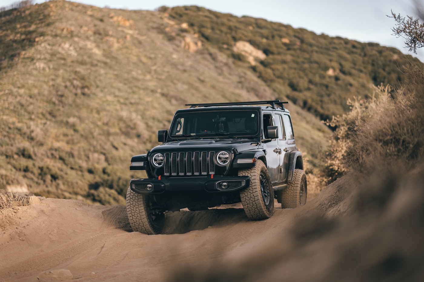 Jeep Wrangler on a sandy offroad trail