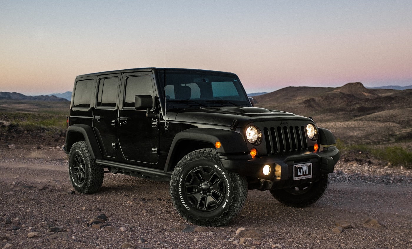 Black Jeep Wrangler Rubicon on a desert trail